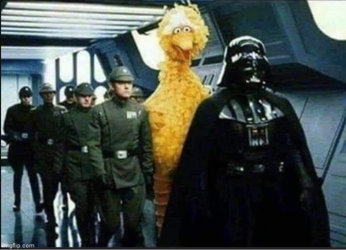 Big Bird is out of place walking with Darth Vader and Imperial officers